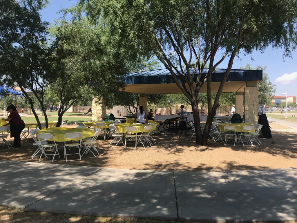 Tables and chairs are set up around a well-kept Marana park gazebo for our Kappcon Summer BBQ. Plenty of shade and space to relax, have fun, and cool off for our hard working employees.
